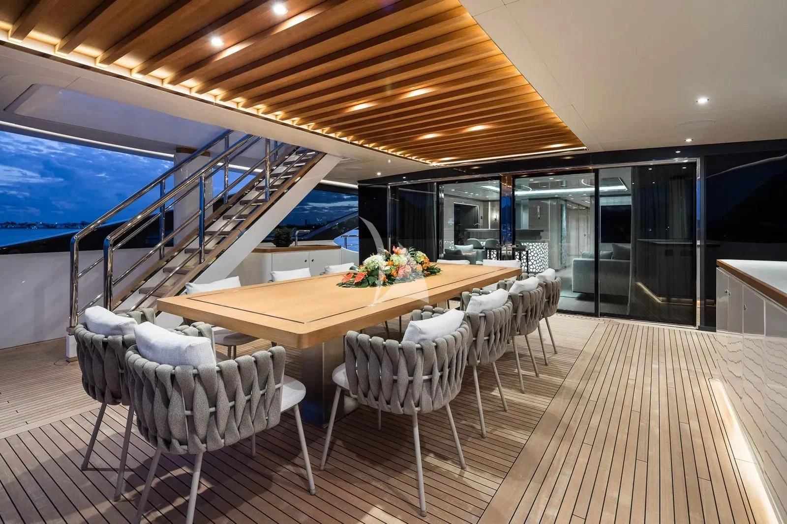 a room with a table and chairs aboard BIRUBI Yacht for Sale