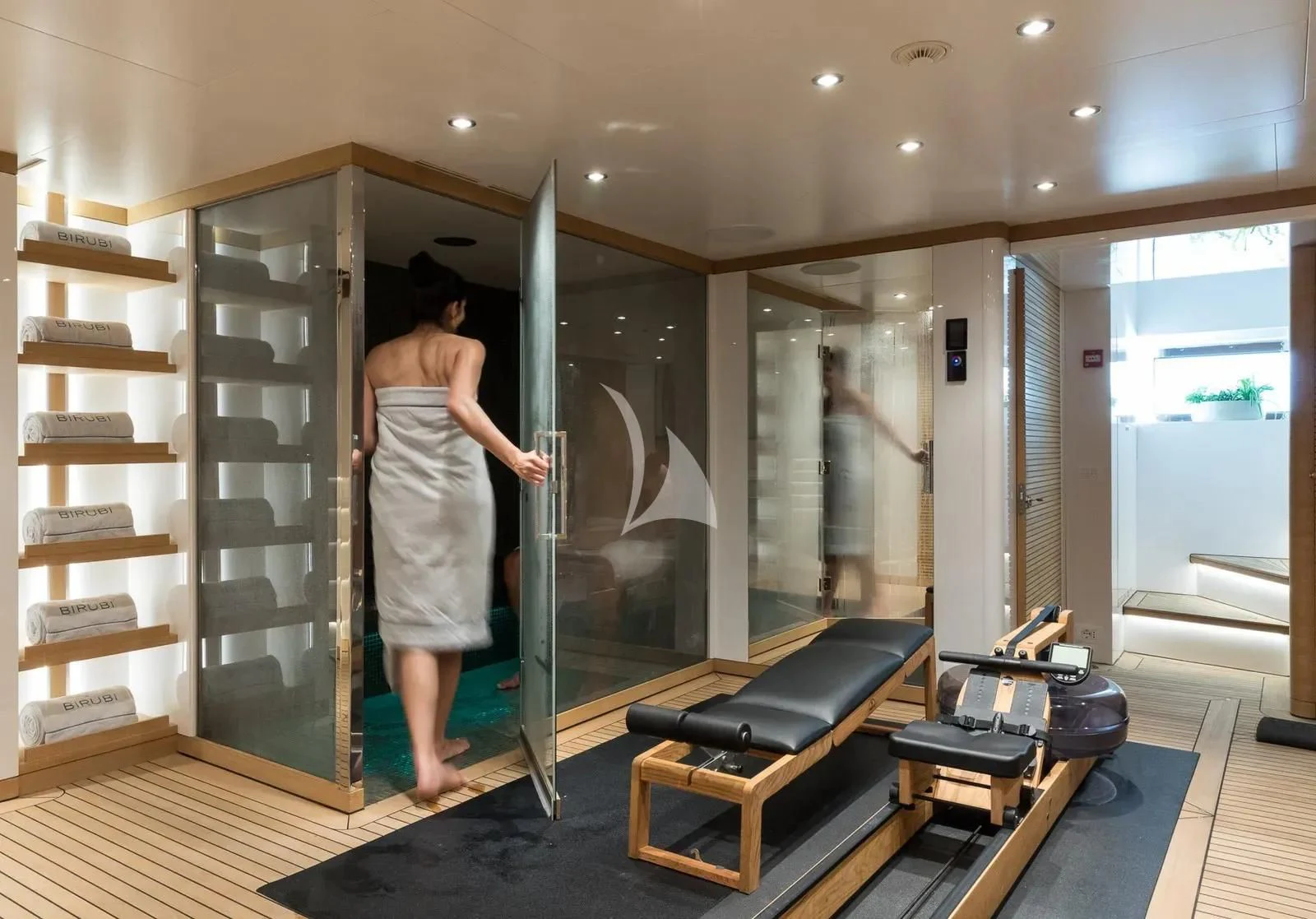 a person in a white dress in a room with a piano and a piano aboard BIRUBI Yacht for Sale
