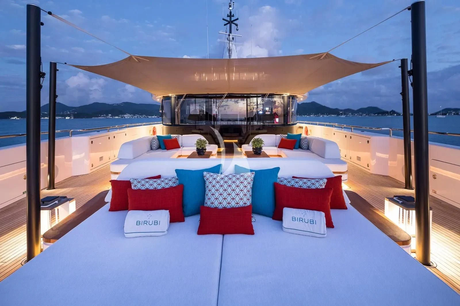 a room with a bed and a table aboard BIRUBI Yacht for Sale