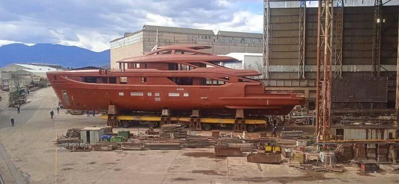a large red boat aboard BIRUBI Yacht for Sale