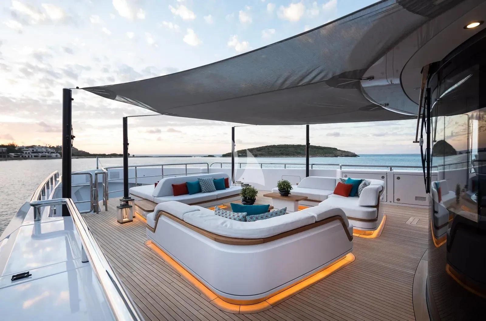 a deck with a pool and a deck with a view of the ocean aboard BIRUBI Yacht for Sale
