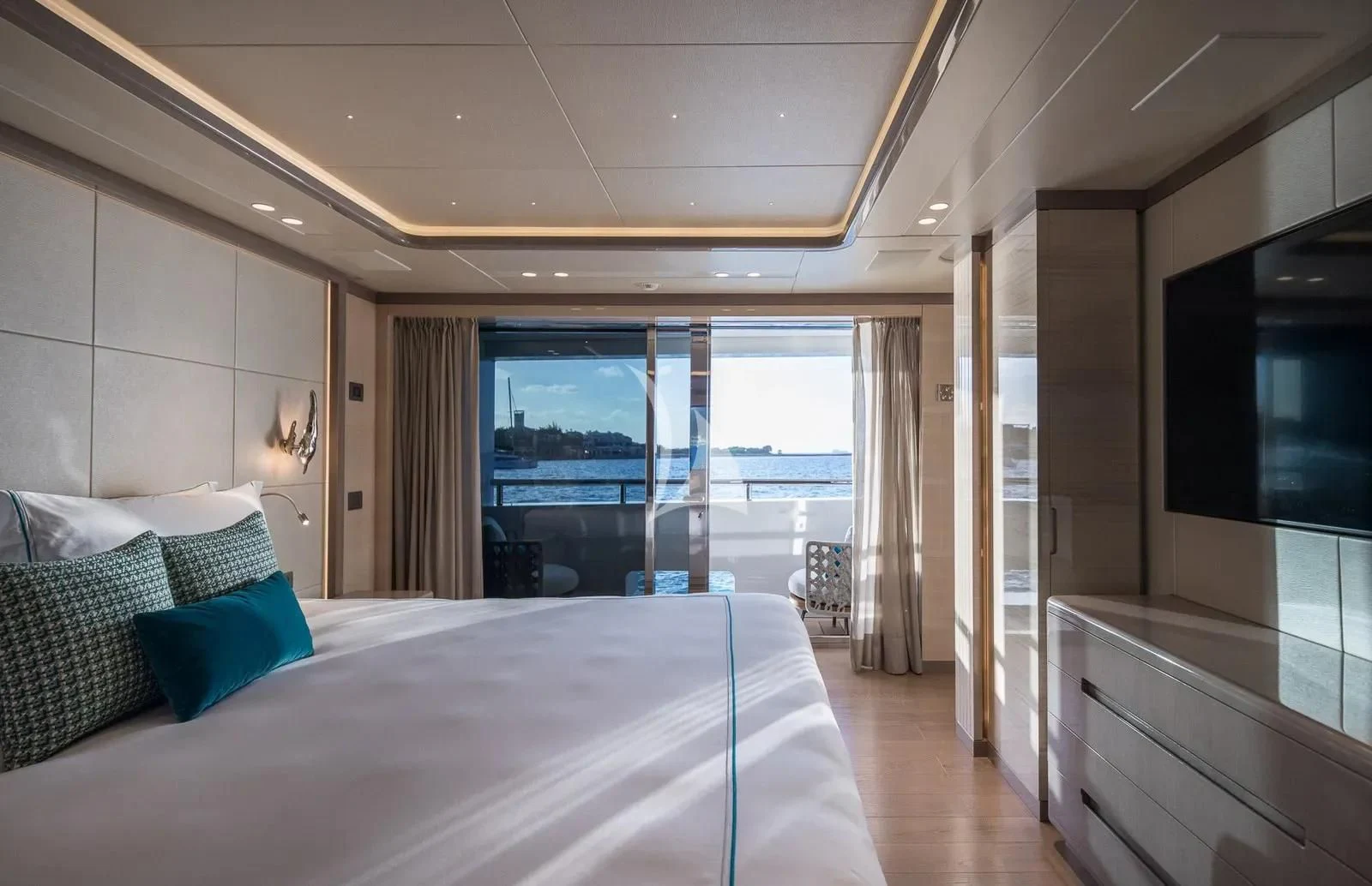 a bedroom with a large bed aboard BIRUBI Yacht for Sale