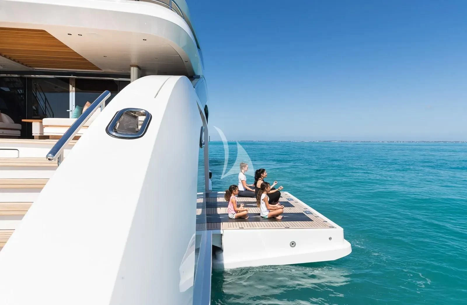 a group of people sitting on a boat aboard BIRUBI Yacht for Sale
