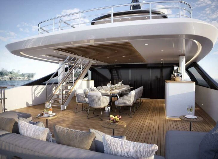 a living room with a large staircase aboard BIRUBI Yacht for Sale