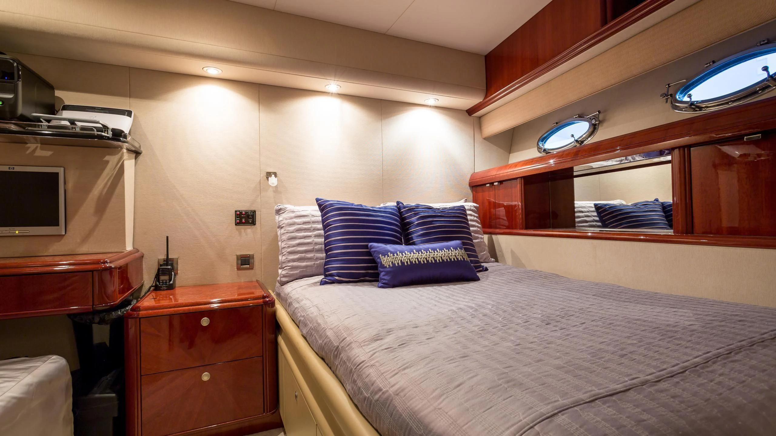 a bedroom with a bed and a television aboard ALWAYS BAREFOOT Yacht for Sale