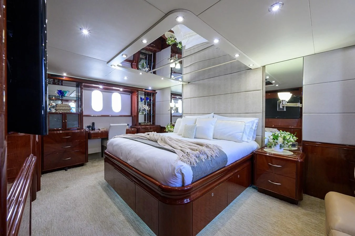 a bedroom with a bed and a dresser aboard ALWAYS BAREFOOT Yacht for Sale