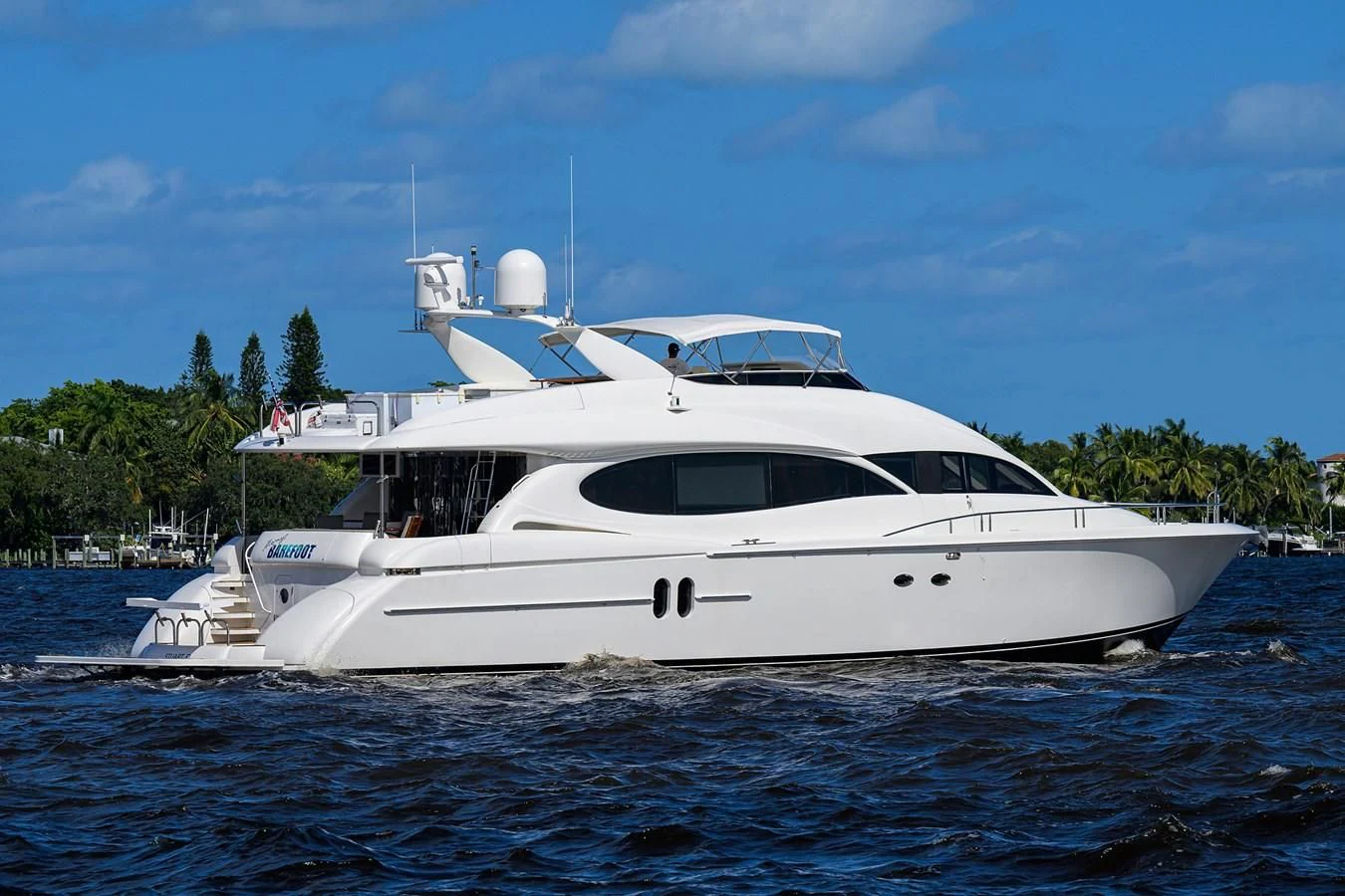 a white yacht in the water aboard ALWAYS BAREFOOT Yacht for Sale