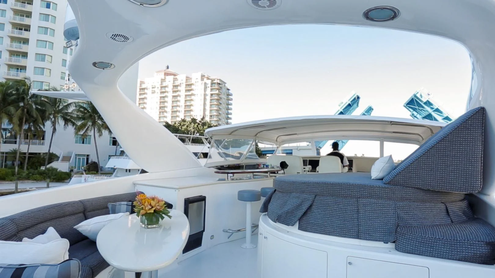 a lounge area with a large white building and a large white tent aboard ALWAYS BAREFOOT Yacht for Sale
