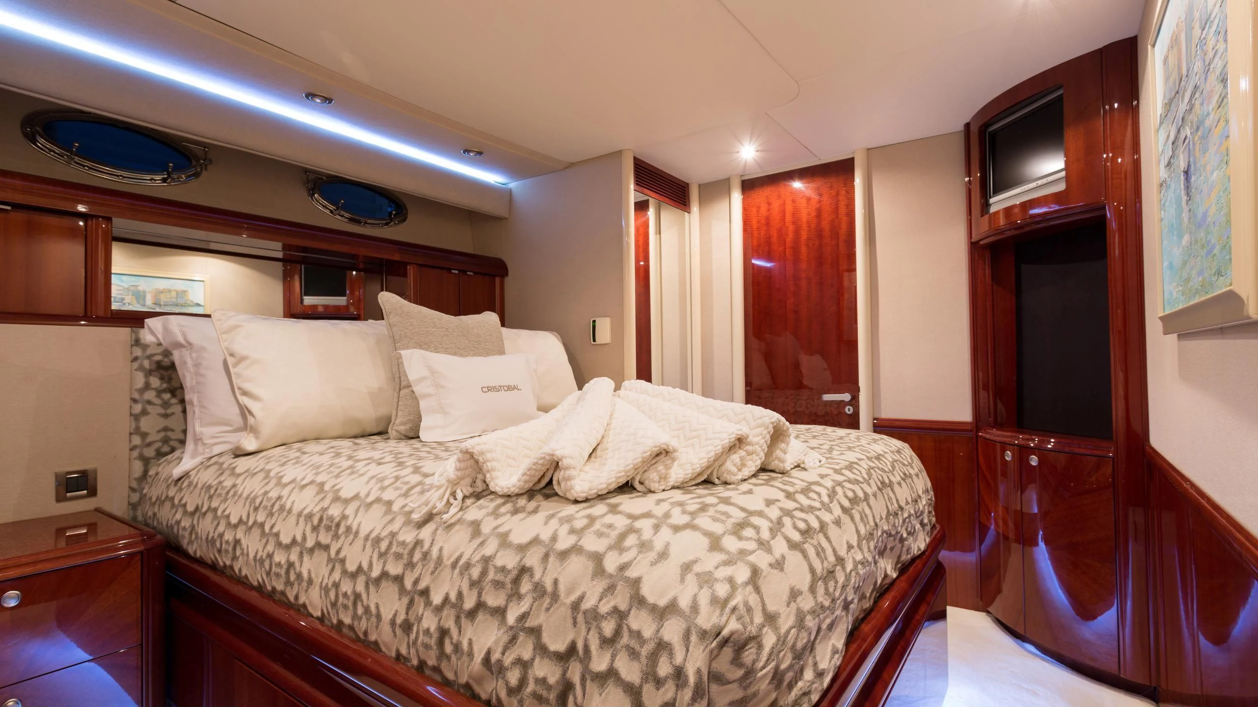 a bed with a white comforter aboard ALWAYS BAREFOOT Yacht for Sale