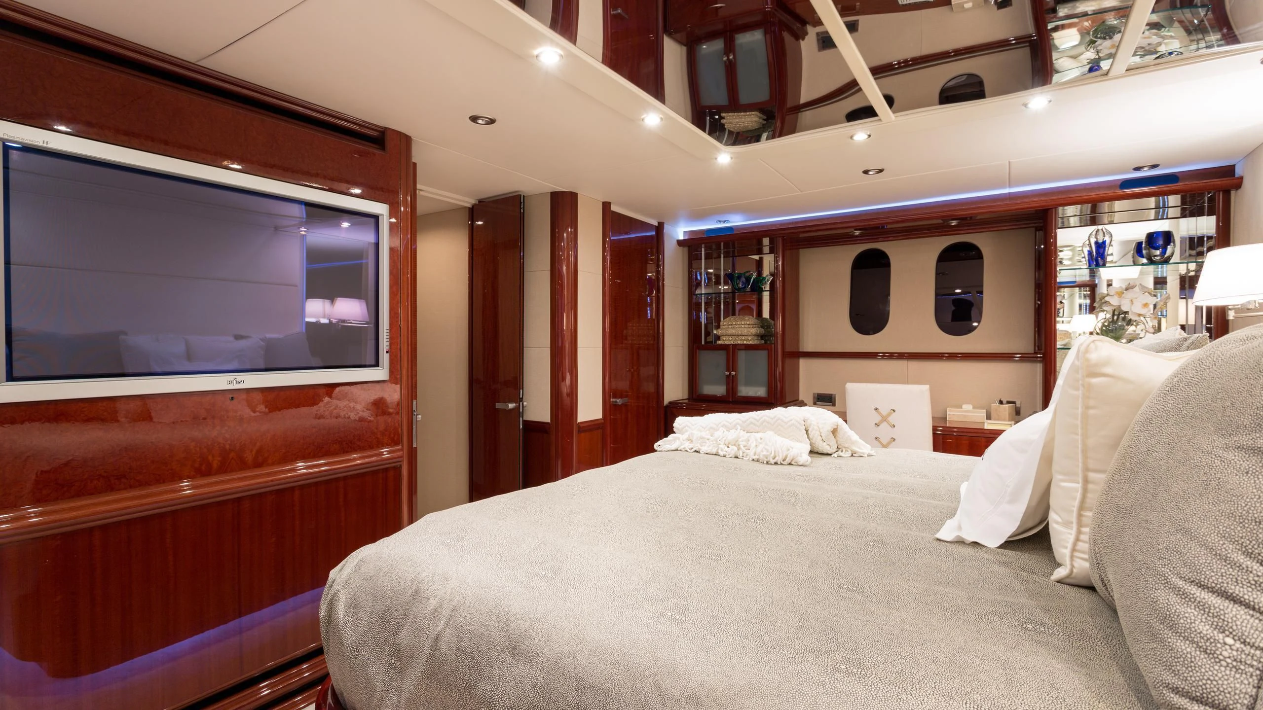 a room with a bed and a television aboard ALWAYS BAREFOOT Yacht for Sale
