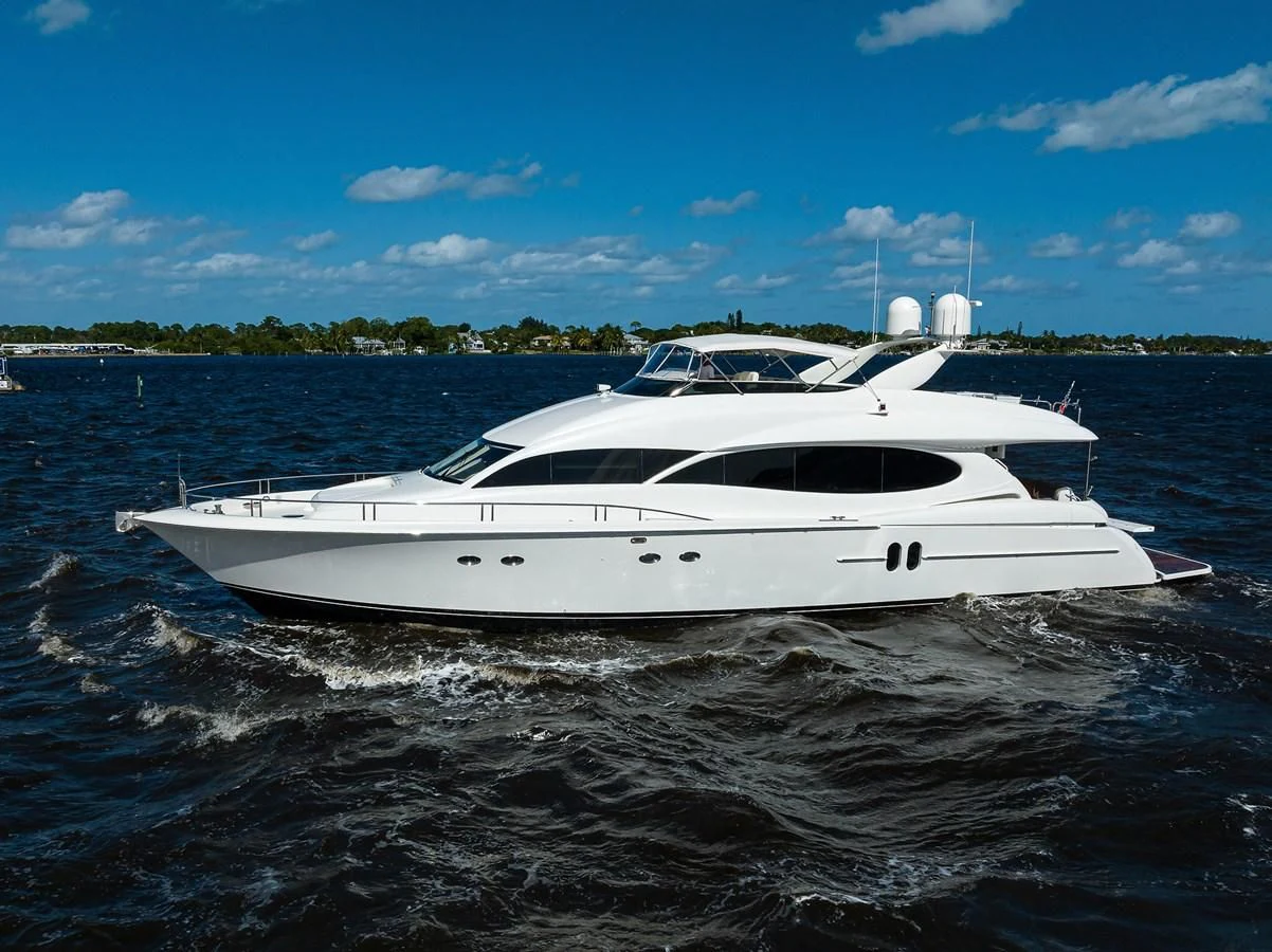 a white boat on the water aboard ALWAYS BAREFOOT Yacht for Sale