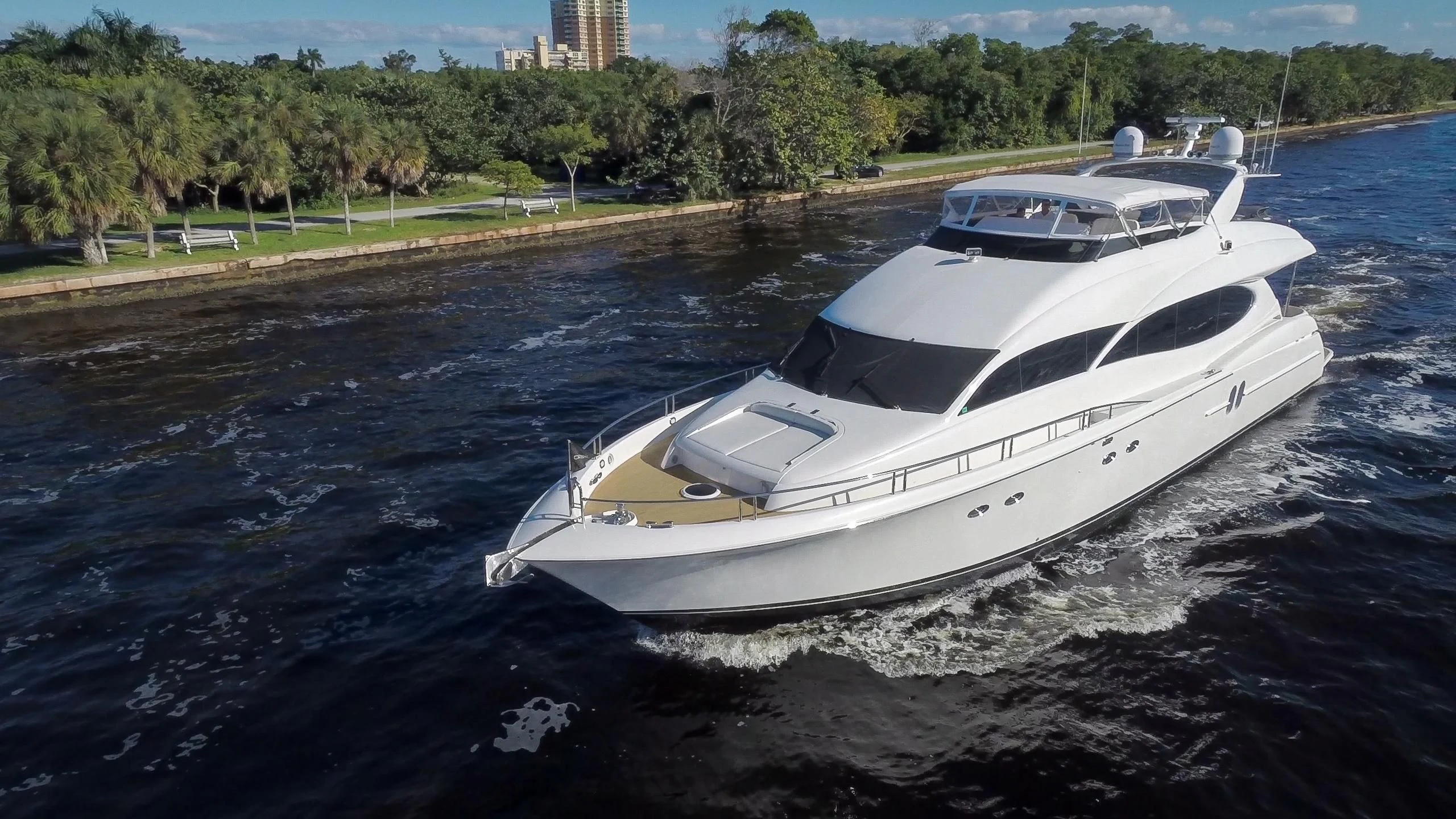 a white yacht in the water aboard ALWAYS BAREFOOT Yacht for Sale
