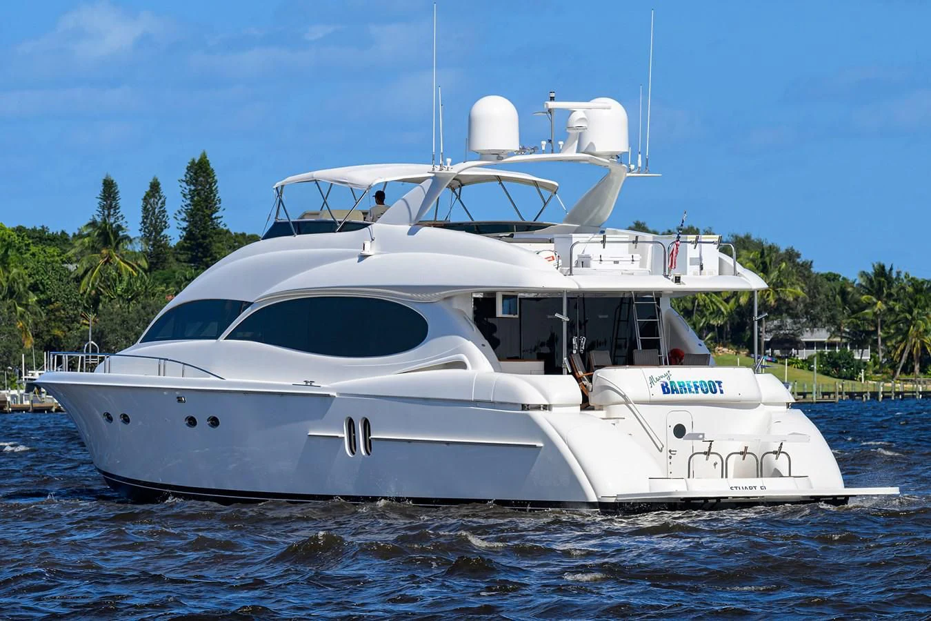 a white boat on the water aboard ALWAYS BAREFOOT Yacht for Sale