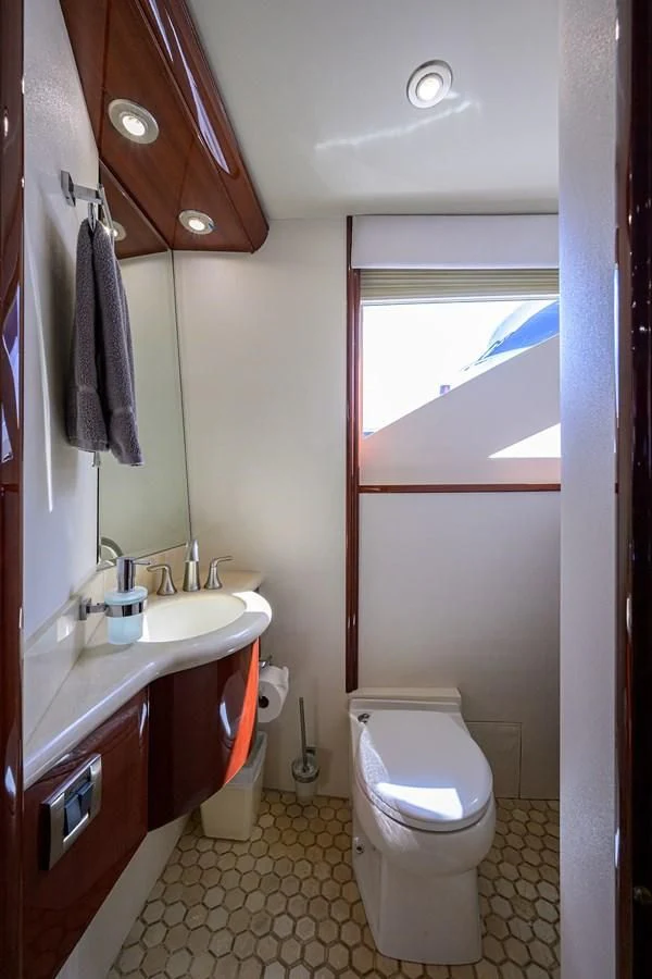 a bathroom with a toilet and sink aboard ALWAYS BAREFOOT Yacht for Sale