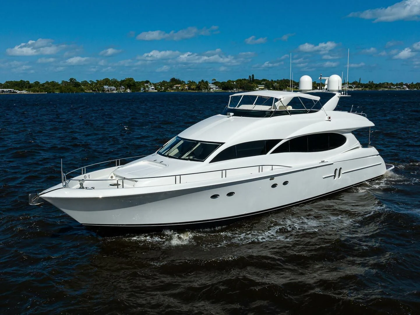 a white boat on water aboard ALWAYS BAREFOOT Yacht for Sale