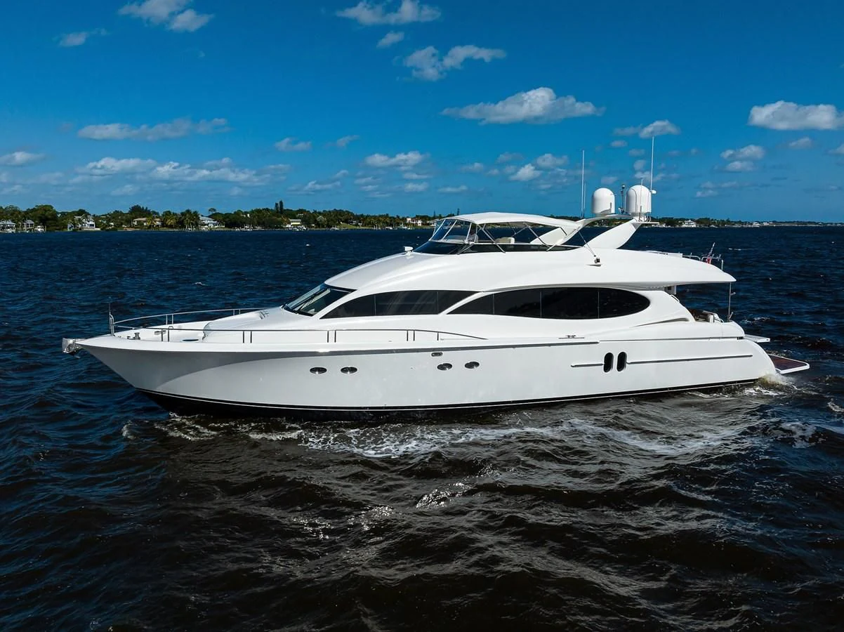 a white yacht on the water aboard ALWAYS BAREFOOT Yacht for Sale