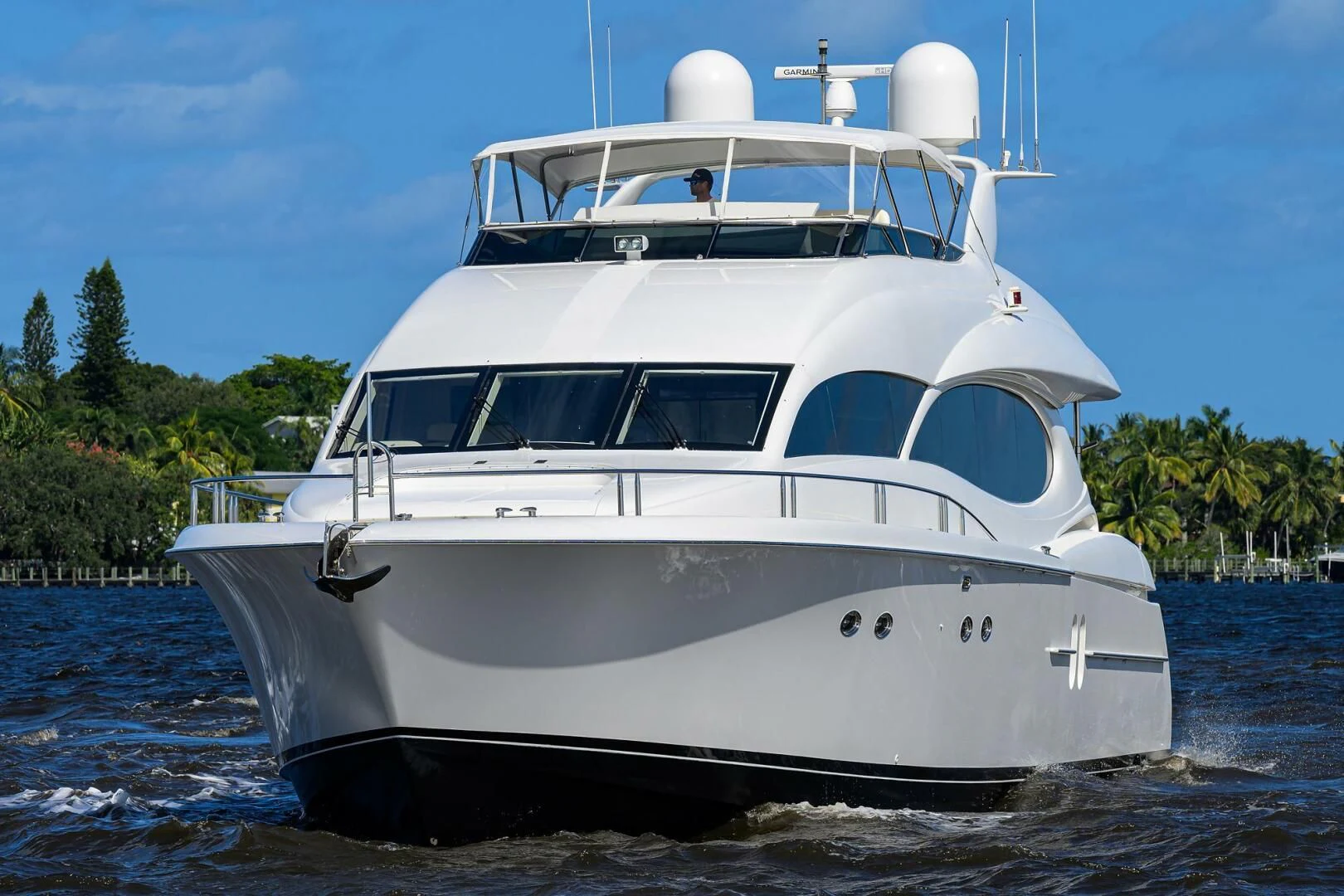 a white yacht on the water aboard ALWAYS BAREFOOT Yacht for Sale