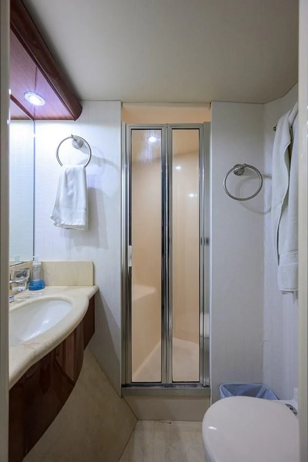 a bathroom with a glass shower aboard ALWAYS BAREFOOT Yacht for Sale