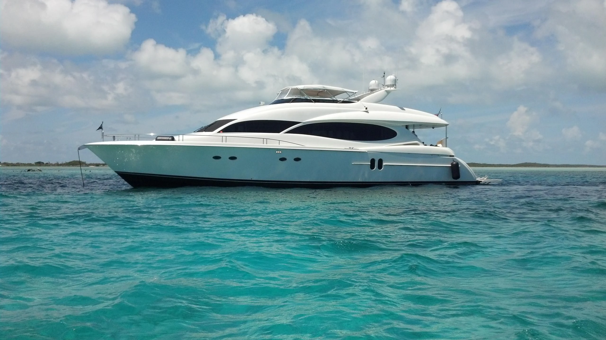 a white yacht in the water aboard ALWAYS BAREFOOT Yacht for Sale