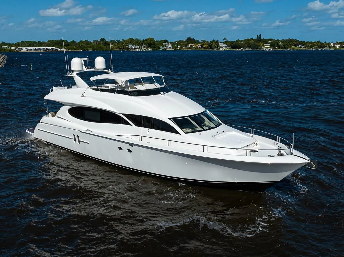 a white boat in the water aboard ALWAYS BAREFOOT Yacht for Sale