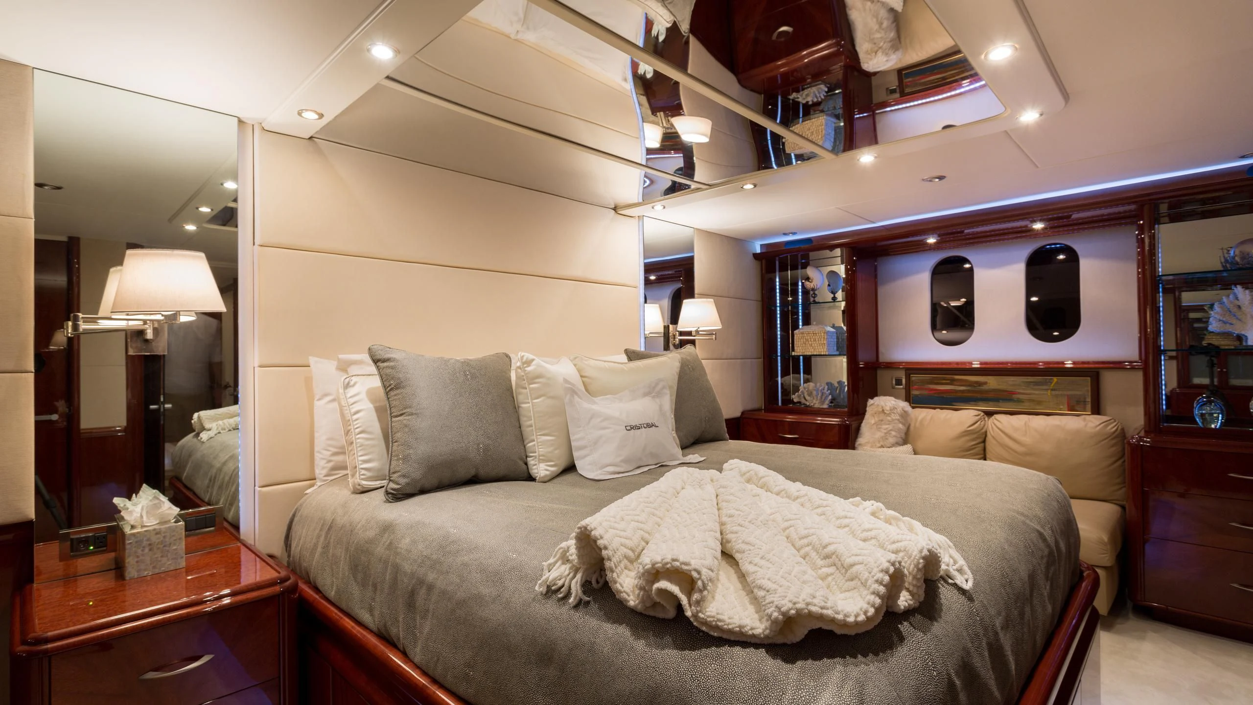 a bed with a mirror above it aboard ALWAYS BAREFOOT Yacht for Sale
