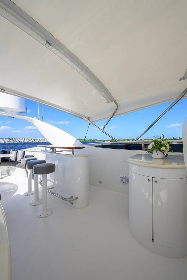 a white kitchen with a large window overlooking the ocean aboard ALWAYS BAREFOOT Yacht for Sale