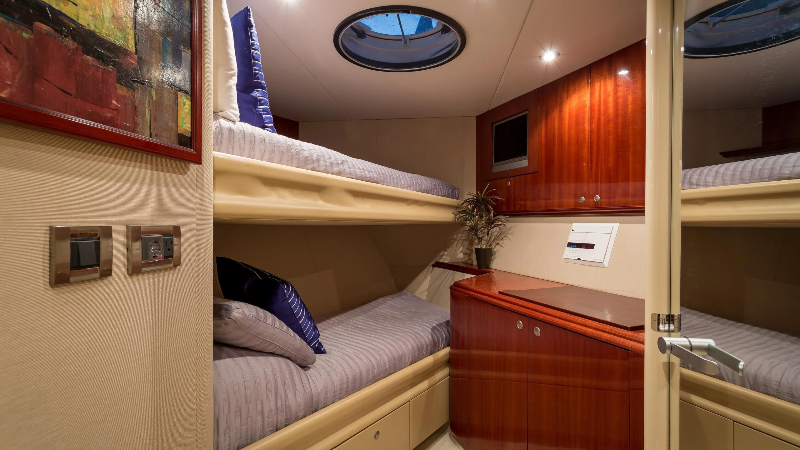 a room with a bed and a desk aboard ALWAYS BAREFOOT Yacht for Sale