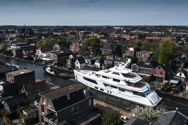 a large white boat in a harbor aboard CALLISTO Yacht for Sale