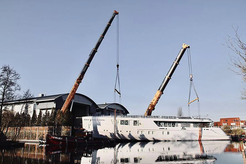 a large white boat with a crane on top of it aboard CALLISTO Yacht for Sale