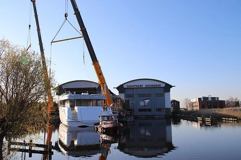 a crane lifting a boat aboard CALLISTO Yacht for Sale