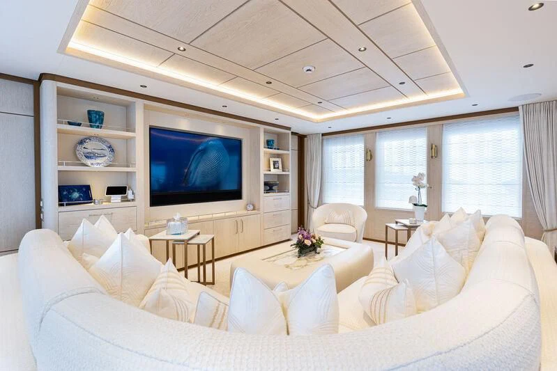 a living room with a large television aboard CALLISTO Yacht for Sale