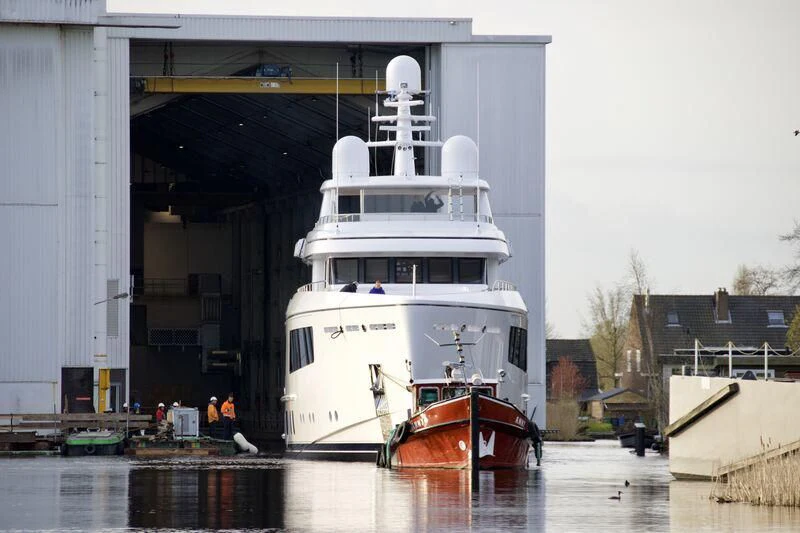 a large white ship docked aboard CALLISTO Yacht for Sale