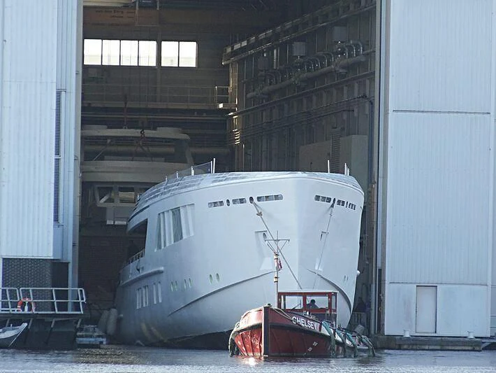 a large white boat in a warehouse aboard CALLISTO Yacht for Sale