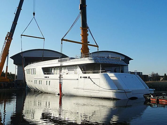 a white boat docked at a dock aboard CALLISTO Yacht for Sale