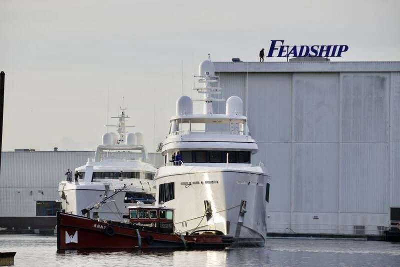 a couple of large boats in a harbor aboard CALLISTO Yacht for Sale