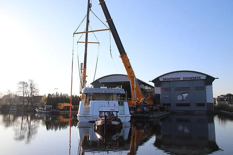 a crane lifting a boat aboard CALLISTO Yacht for Sale