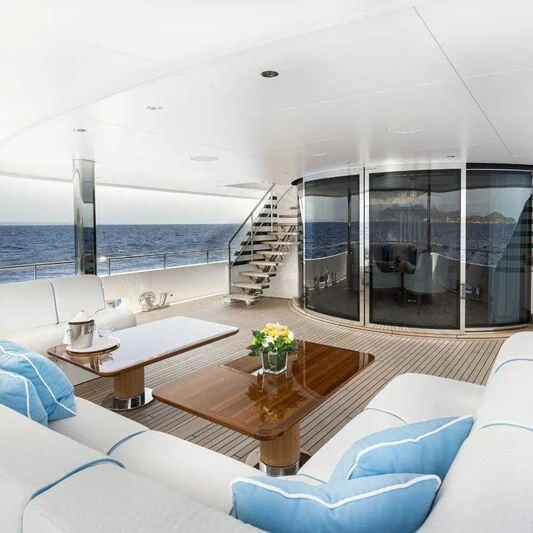 a room with a table and chairs aboard CALLISTO Yacht for Sale