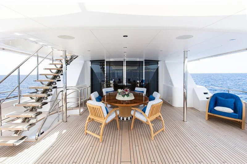 a room with a table and chairs aboard CALLISTO Yacht for Sale