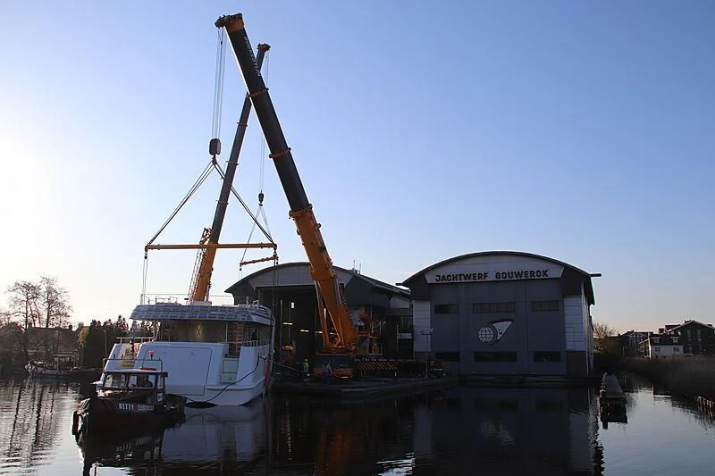 a crane lifting a boat aboard CALLISTO Yacht for Sale