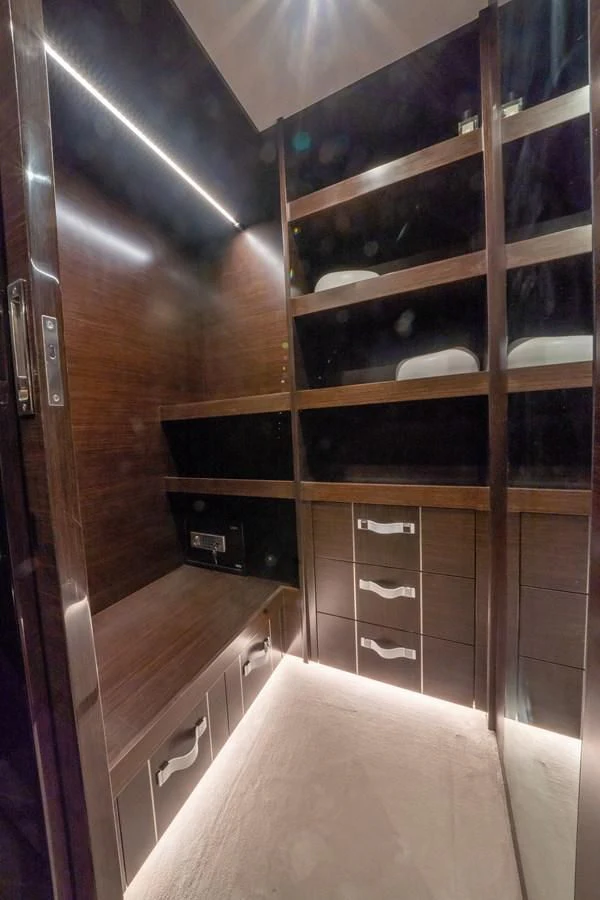 a room with a bed and cabinets aboard OLIVIA RB Yacht for Sale