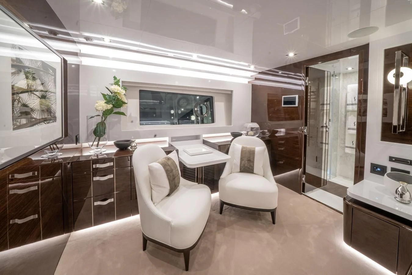 a room with a table chairs and a tv aboard OLIVIA RB Yacht for Sale