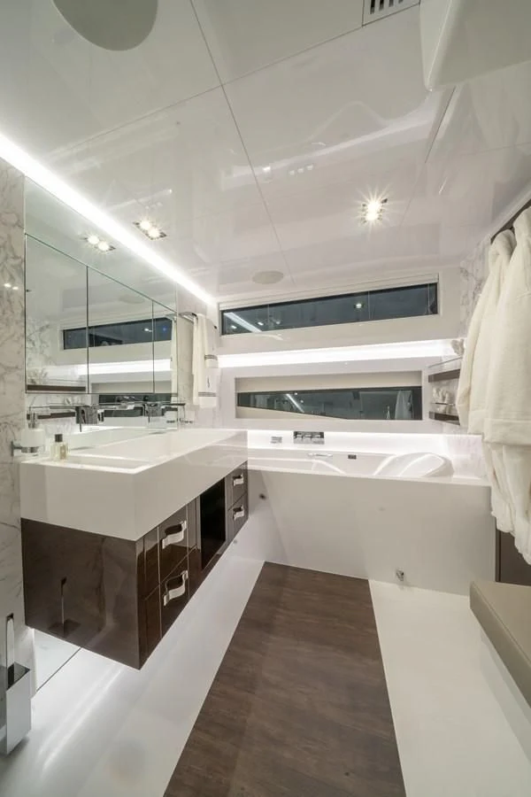 a bathroom with a large mirror aboard OLIVIA RB Yacht for Sale