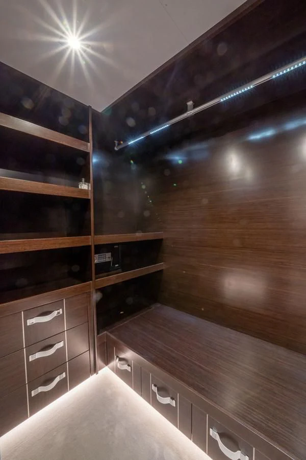 a room with a large wooden cabinet aboard OLIVIA RB Yacht for Sale