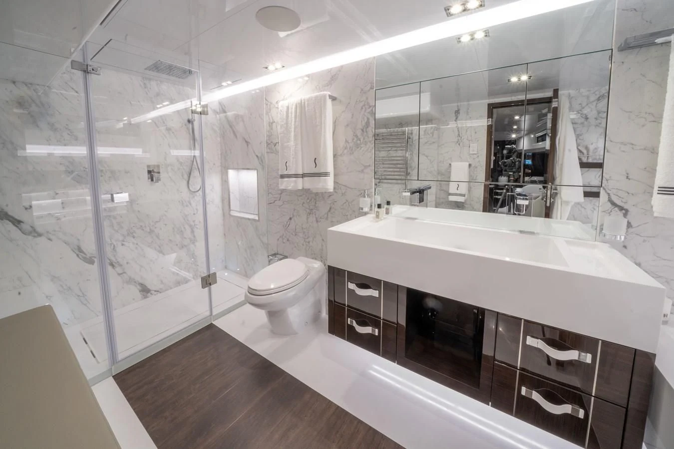 a bathroom with a large mirror aboard OLIVIA RB Yacht for Sale