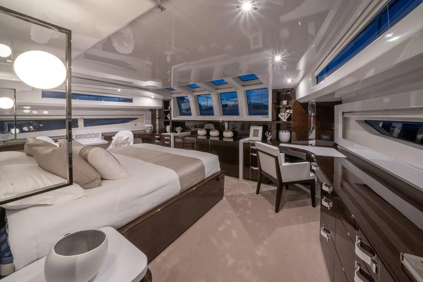 a room with a bed and a table aboard OLIVIA RB Yacht for Sale