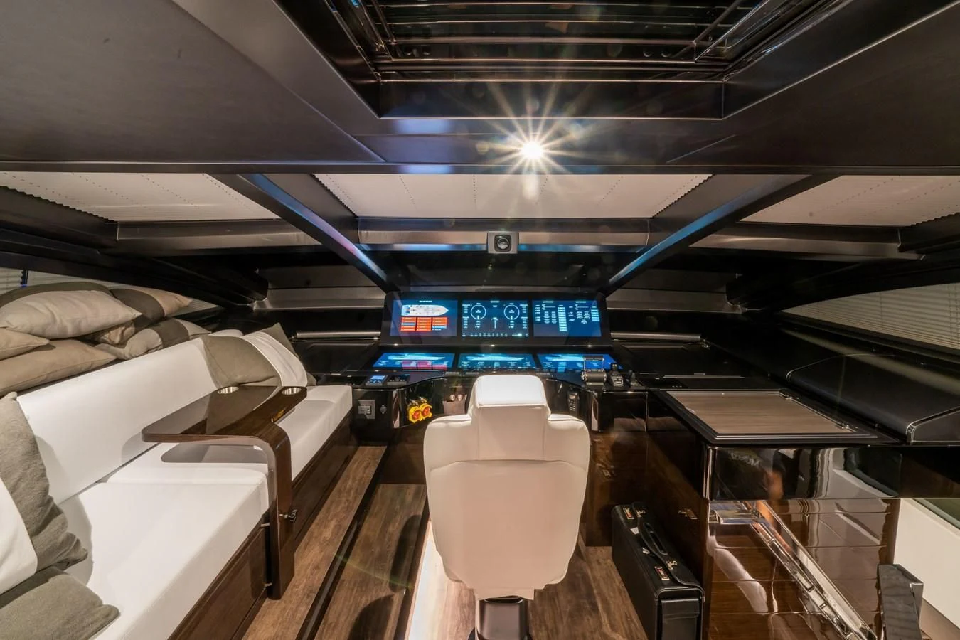 a large room with a bed and a large blue sign on the wall aboard OLIVIA RB Yacht for Sale