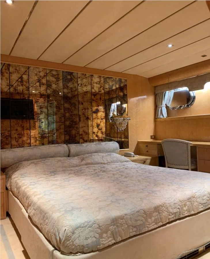 a large bed in a room aboard BAHIRA II Yacht for Sale