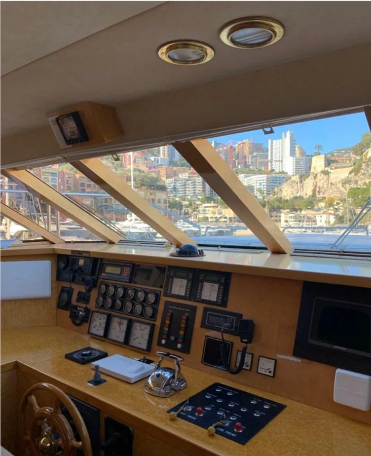 a room with a desk and a window aboard BAHIRA II Yacht for Sale