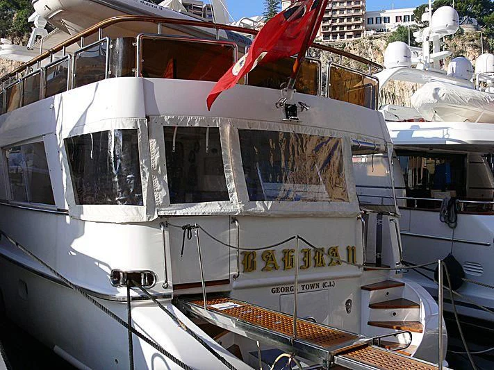 a boat with a flag on the front aboard BAHIRA II Yacht for Sale