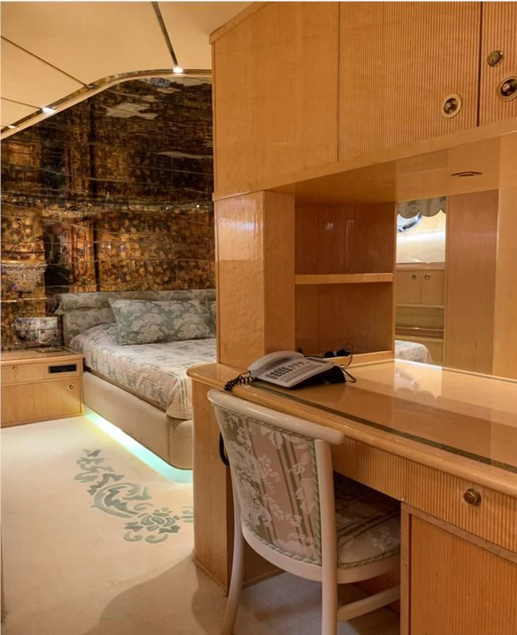 a chair next to a desk aboard BAHIRA II Yacht for Sale